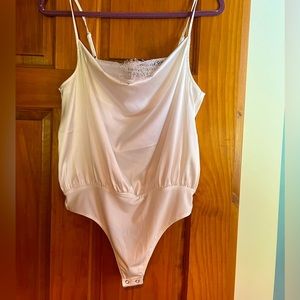 Express satin bodysuit with lace detailing.